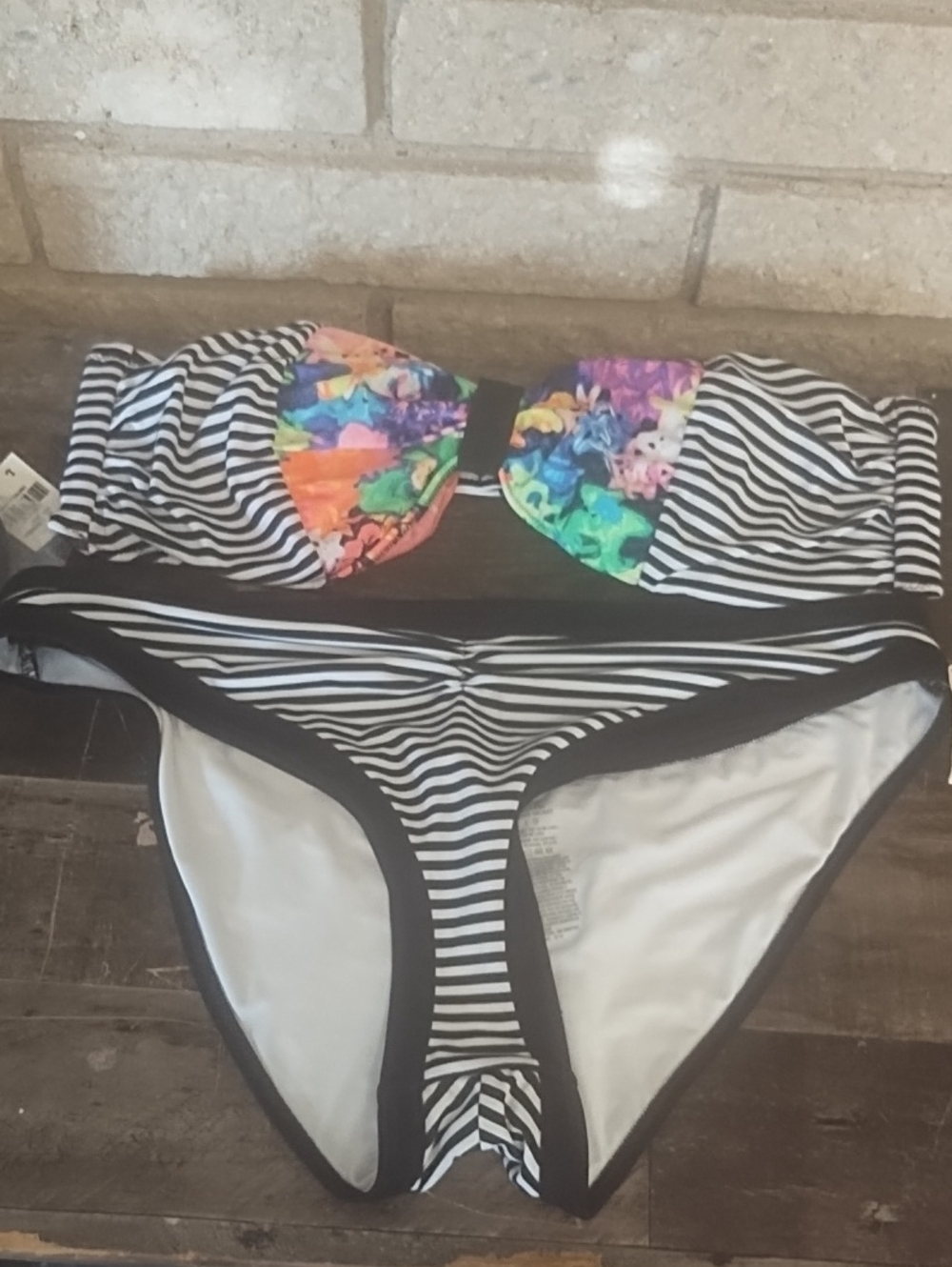 Striped Black & White Kids One-Piece with Colorful Floral Accent